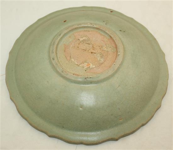 A Chinese Longquan celadon dish and a Ming dynasty lotus bowl, 15th / 16th century, diam. 15cm